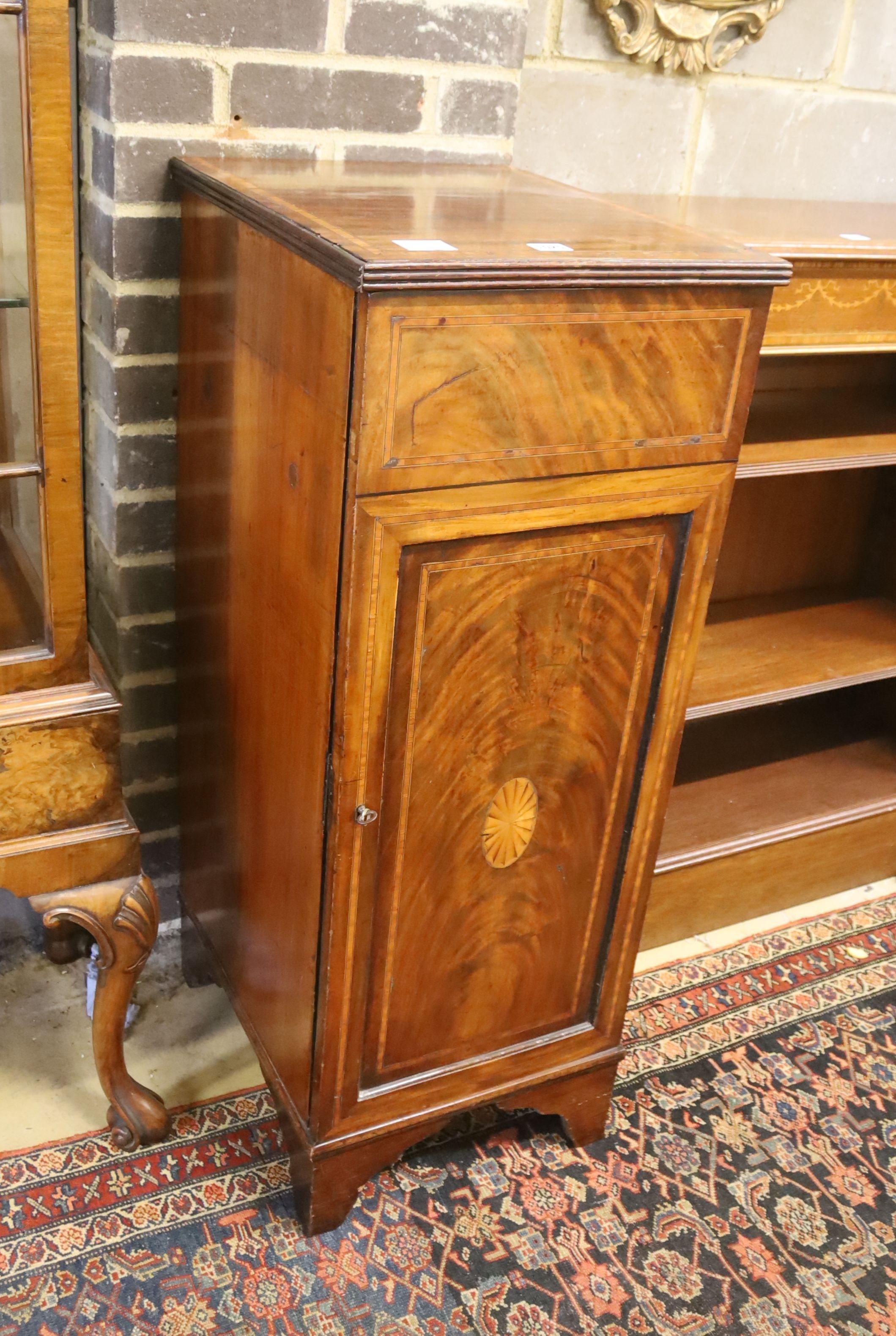 An Edwardian mahogany and satinwood banded pedestal cupboard, (formerly a sideboard section) width 40cm, depth 47cm, height 103cm
